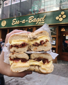 Bacon egg and cheese bagel in front of of Ess-a-bagel on 3rd Ave in Midtown East